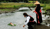 Kurt Grinnell and Pat Adams, Jamestown S’Klallam Tribal members, dedicate Jimmycomelately Creek – with its new meandering flow – for the return of the summer chum salmon. Photo provided by Northwest Indian Fisheries Commission.