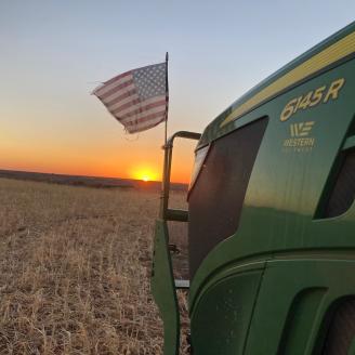 Tractor with flag Oklahoma Sunset