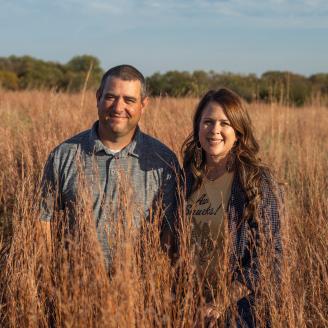 The Wiliams standing in their fall field