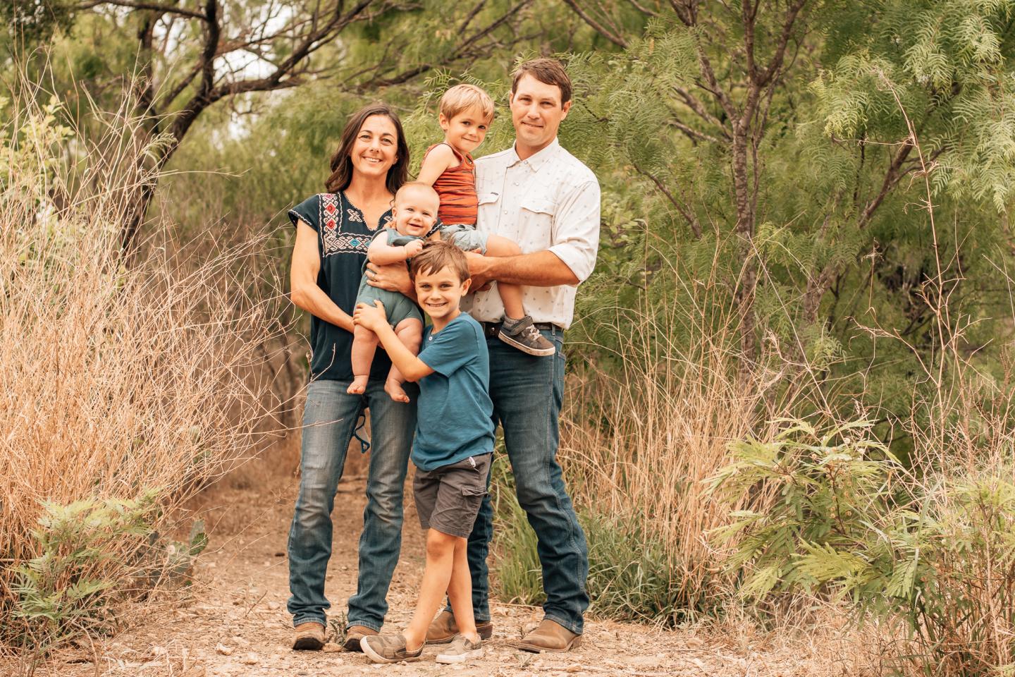 Mandy and Travis Krause with their children at Parker Creek Ranch in D’Hanis, Texas. The Krauses work with the USDA Natural Resources Conservation Service in Texas implement conservation practices on their land, which is located in Medina County.