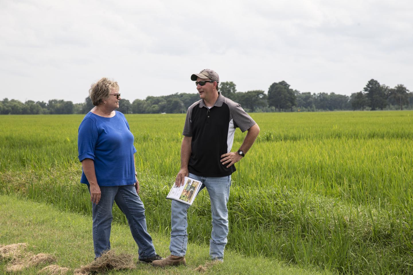 An NRCS employees speaks with a producer.