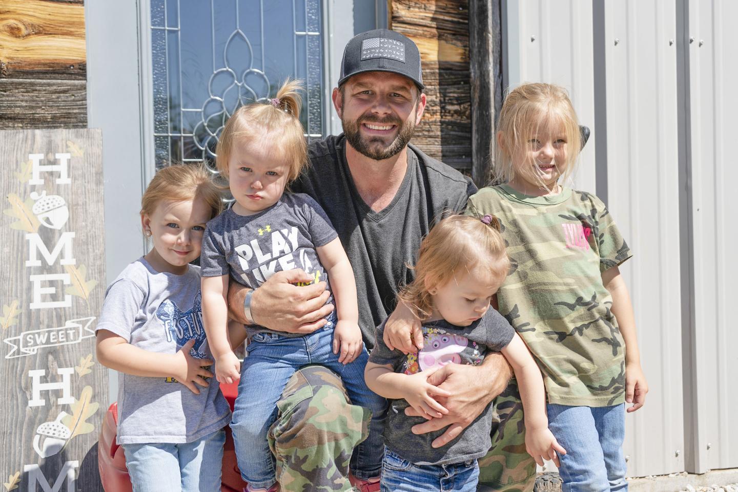 Army Veteran turned rancher Justin Glenn and his four daughters at their rural property in Wise, County, Texas.