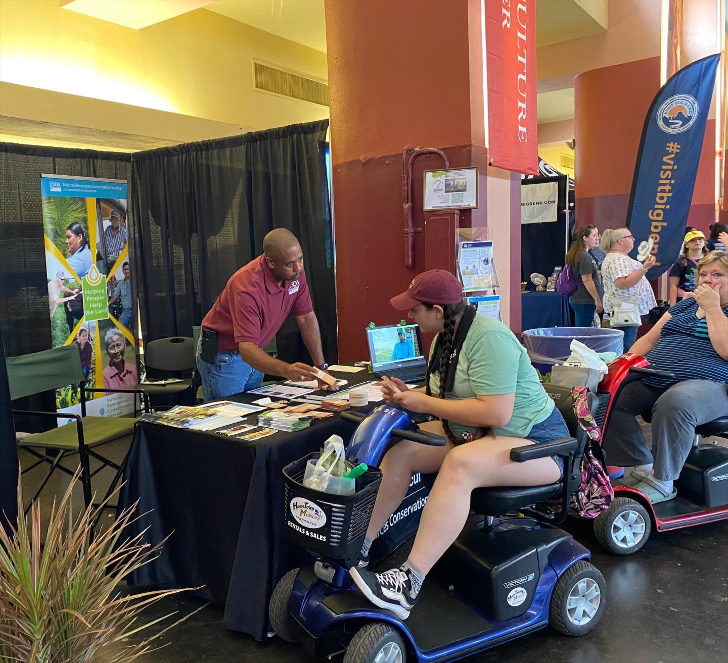 Two people at NRCS booth