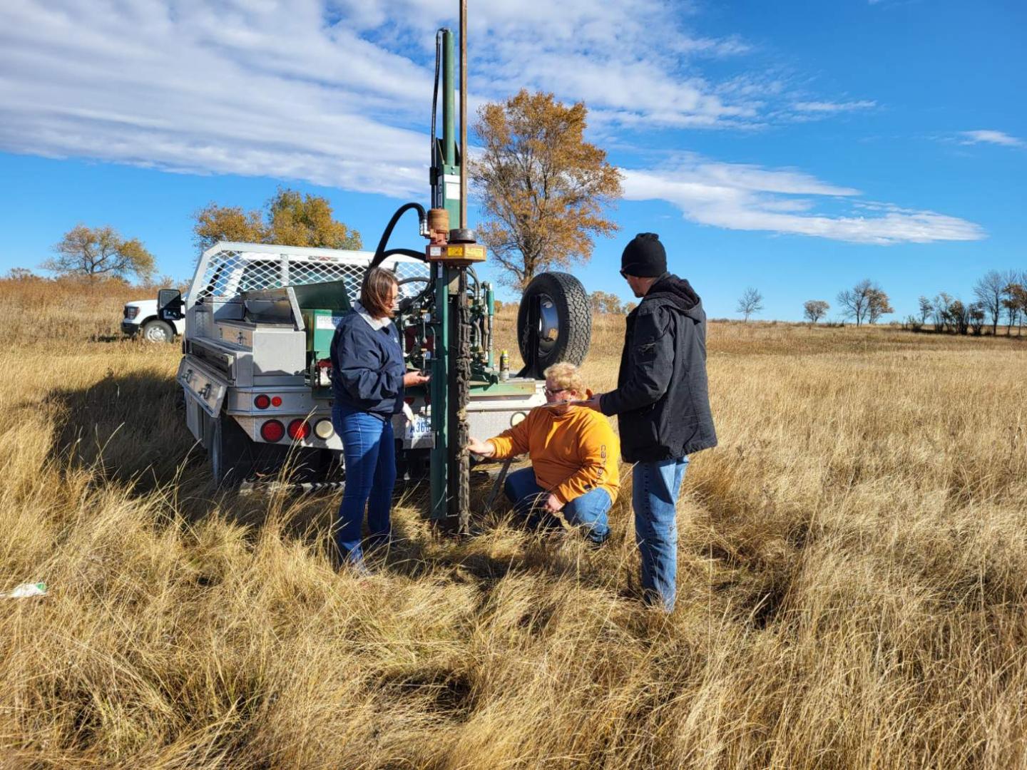 Kate Sobolik, NRCS ND Area Engineer, surveys a field site