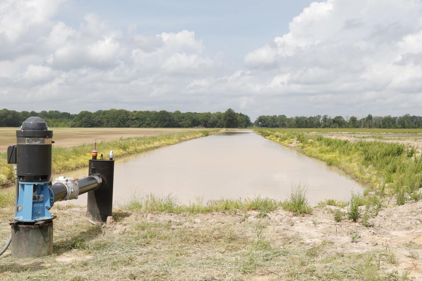 An image of an irrigation reservoir in a field
