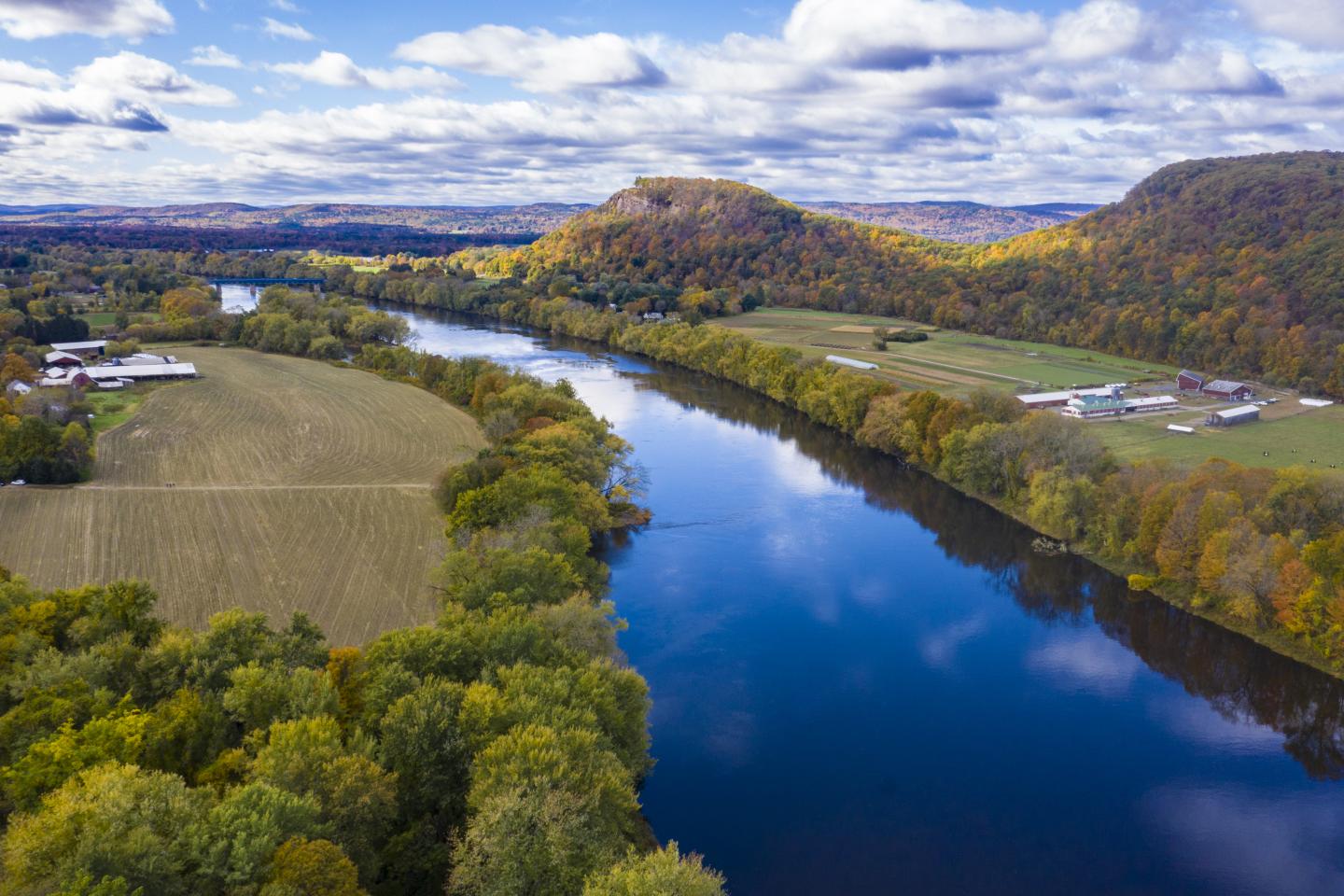 Aerial view of Mt. Toby Farm (left of Connecticut River), in Sunderland, MA, has worked with the U.S. Department of Agriculture (USDA) Natural Resources and Conservation Service (NRCS) to create their conservation plan that includes the use of Forage and biomass Planting  (512) and Establish and reseed their cover crop during the cool season, on October 18, 2019. Working with Natural Resource Specialist / Business Tools Coordinator Lisa Gilbert who records the progress with the conservation plan. USDA Photo