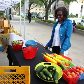 Loyal customer Cynthia Brathwaite  attends Wayne State University Market Day to purchase D-Town Farm’s fresh produce. 
