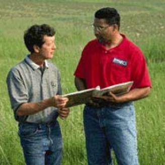 NRCS and Farmer in a Field