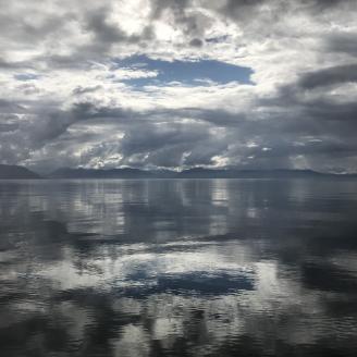 clouds reflected on water in Alaska