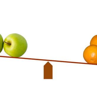 A scale showing apples weighed against oranges