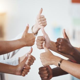 Thumbs up, diversity group and team collaboration in the business workplace.