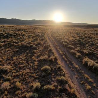 Rangeland with sunset in the distance