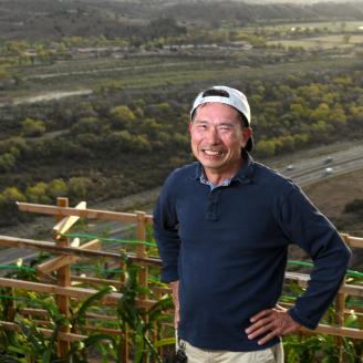 New farmer Leonardo Aguila checks the dragon fruit plants on his 6.3-acre farm in Fallbrook, CA, on Nov. 11, 2018.
Leonardo Aguila is extremely proud of his 6.3-acre farm in Fallbrook, Calif. The mature orchard of avocado trees, on its sunny hillside near San Diego, caught the eye of this Navy veteran three years ago, and he knew he had to buy it. Some of the trees showed signs of stress due to lack of irrigation from the high cost of water and regular drought - it just needed some tender loving care. Agui