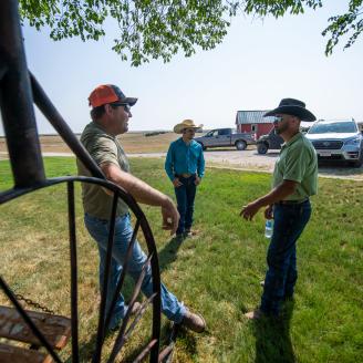 U.S. Department of Agriculture, USDA, Natural Resources Conservation Services, NRCS, State Grazing Land Soil Health Specialist Tanse Herrmann, right, talks with Cammack Buffalo Ranch co-owner John Cammack, left, who operate a 13,000-acre buffalo ranch with 600 mother cows, in Stoneville, SD, on July 21, 2021. John Cammack is a fourth-generation rancher. 
This year's main challenge is the drought and how best to adapt grazing practices to the lack of water. During normal seasons, the many streams on the ranc