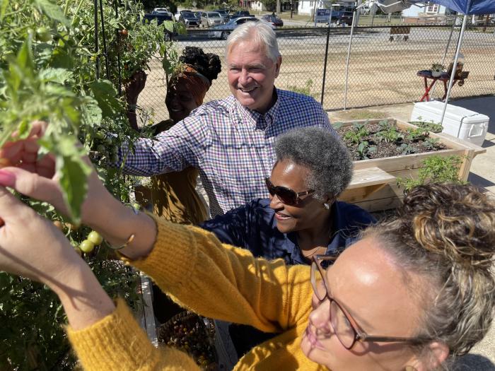 Clinton Mayor, Councilwoman and Gardener select fruit for community basket