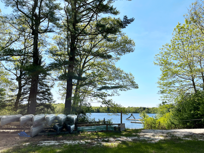 Canoes stored next to Larkins Pond at Camp Hoffman Girl Scout Camp, South Kingstown, Rhode Island.