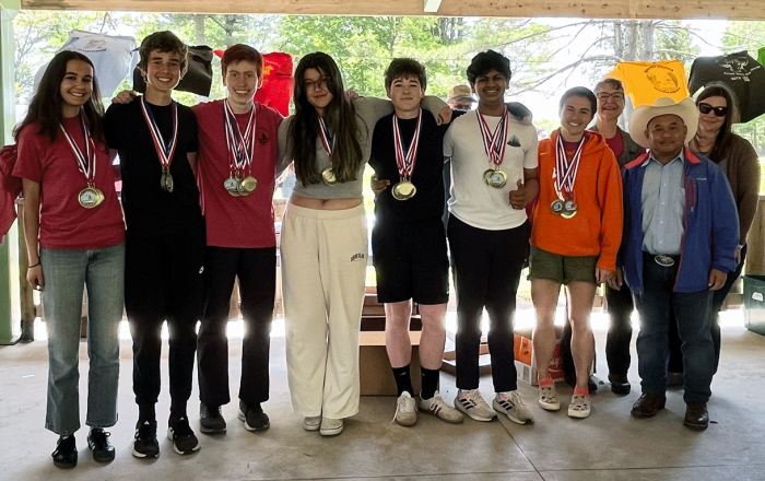 2024 Rhode Island Envirothon Champions - The Wheeler School Team 1 - pose with their teacher and NRCS State Conservationist, R. Phou Vongkhamdy.