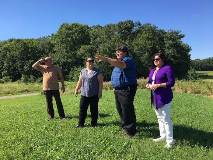 People standing in a field.