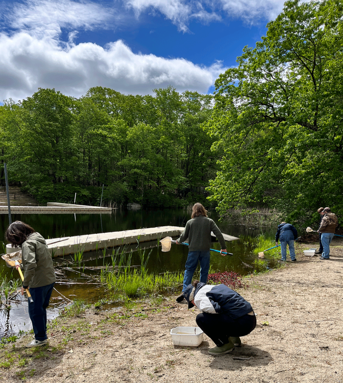2025 Rhode Island Envirothon competitors take water samples at the Aquatics station.