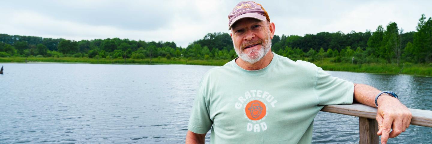Tom Dykstra poses for a portrait over looking the main pond on his WRE site