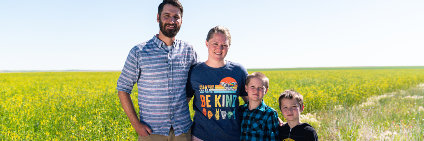 Organic farmers Michael and Emily Deakin with their sons on Deakin Farms. Pondera County, MT.