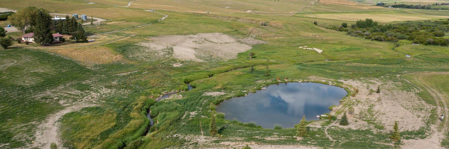 Location of Theisen Ranch that previously housed an Concentrated Animal Feeding Operation (CAFO). Since relocation of the CAFO, pond has been added, native grasses are returning and water quality has improved. Park County, MT.