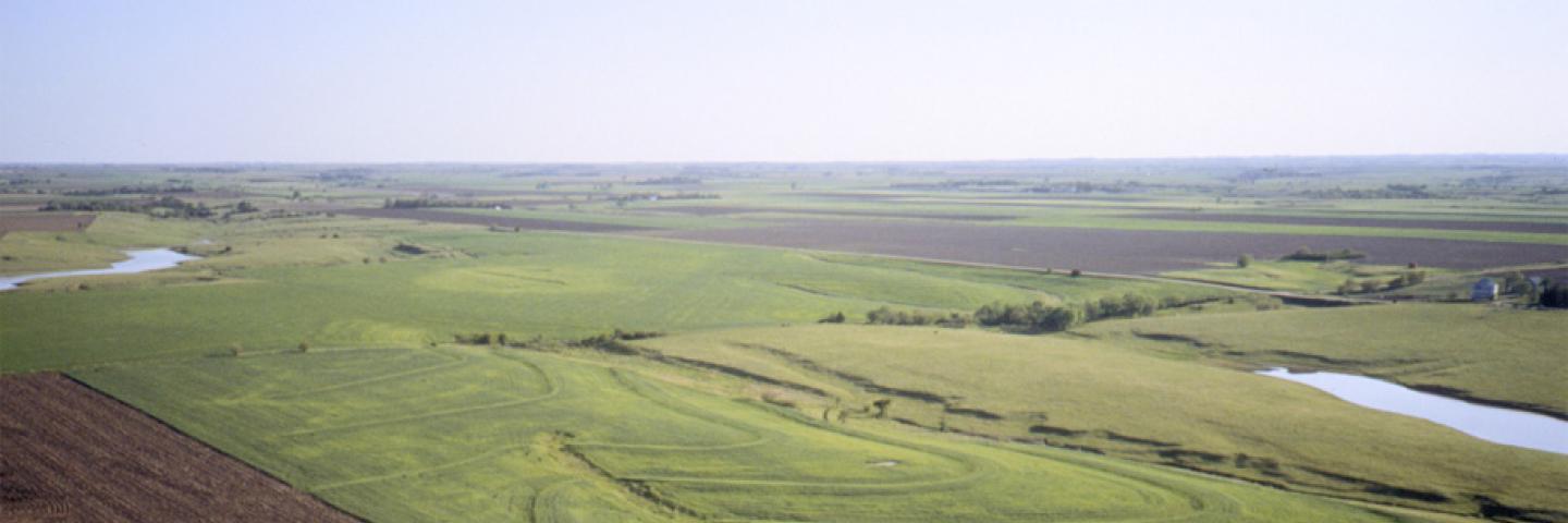 Aerial photo of a tilled field and grassland