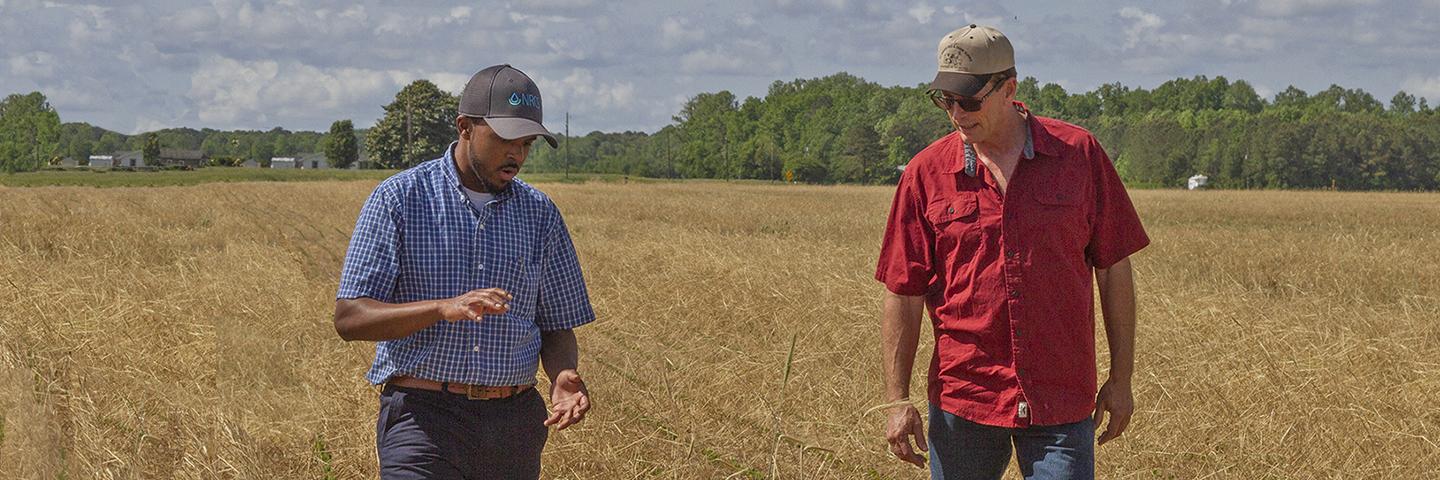 NRCS conservationist on a field visit with a Virginia farmer.