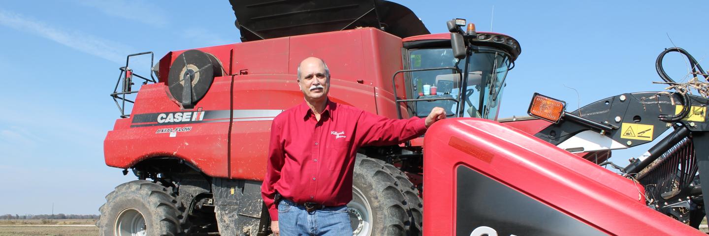 Don Villwock in front of a combine