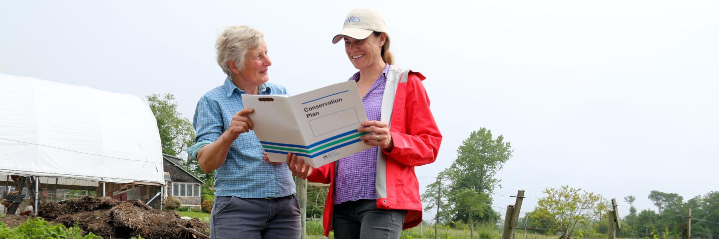 A farmer and an NRCS planner in the field.