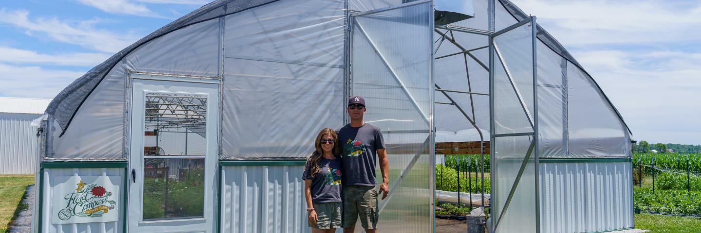 Carrie Kleiman (left), the owner of Floral Compass Flower Farm in Fountaintown, Indiana, and her husband Nick Kleiman, pictured at the farm on June 28, 2022.
