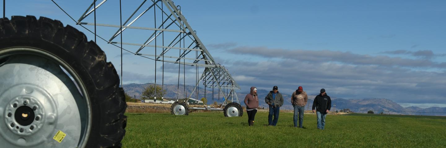 Producers walk with NRCS representatives and check out the linear pivot. 