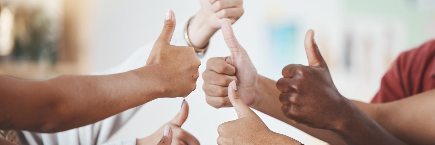 Thumbs up, diversity group and team collaboration in the business workplace.