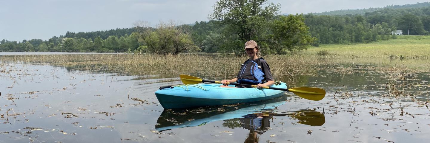 Tess Overstreet kayaking through flooded easements