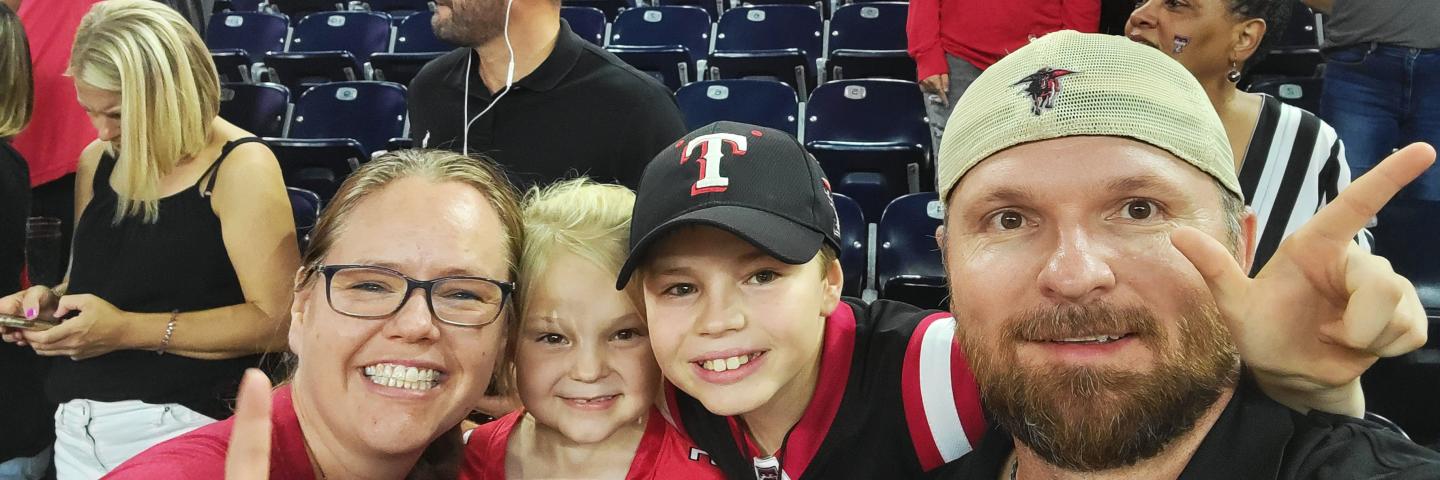Kathleen Traweek and family during a Texas Tech game.