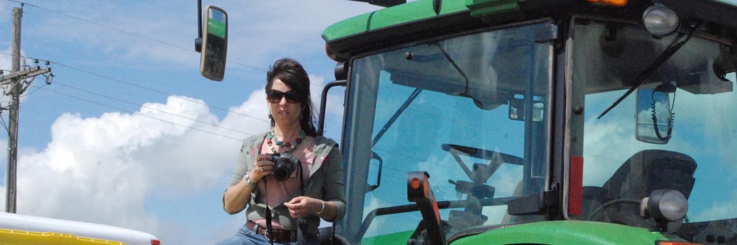 Quenna Terry shooting pics from a Tractor
