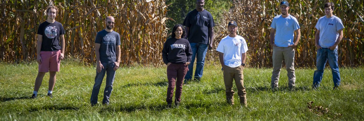 Students standing in cornfield