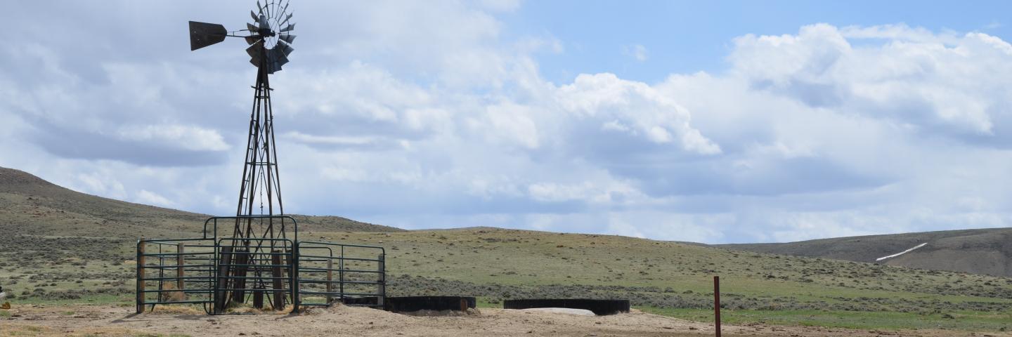 Windmill well on ranch in Wyoming, blue skies