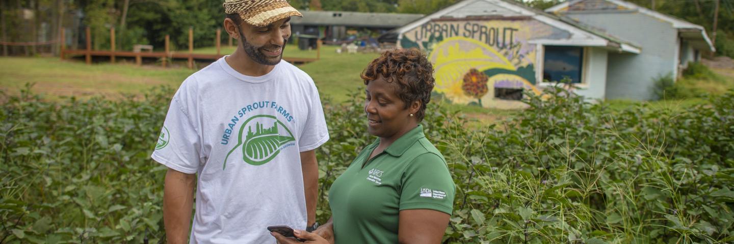NRCS field staff assisting Urban Ag farmer at their property.