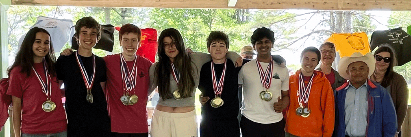 2024 Rhode Island Envirothon Champions - The Wheeler School Team 1 - pose with their teacher and NRCS State Conservationist, R. Phou Vongkhamdy.