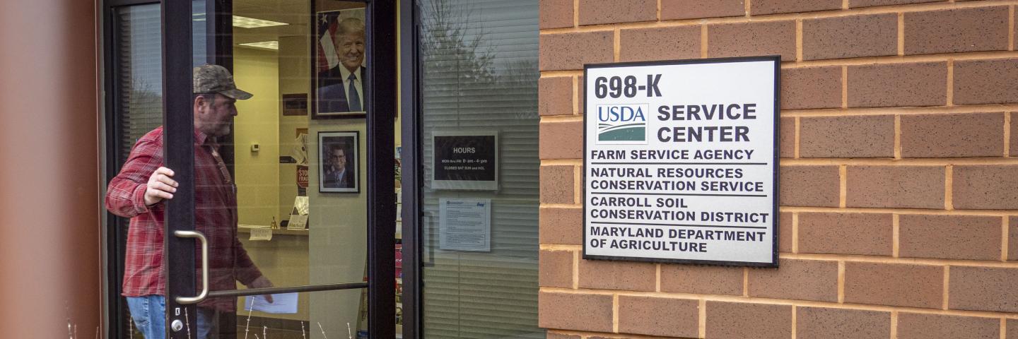 Farmer walking into Service Center