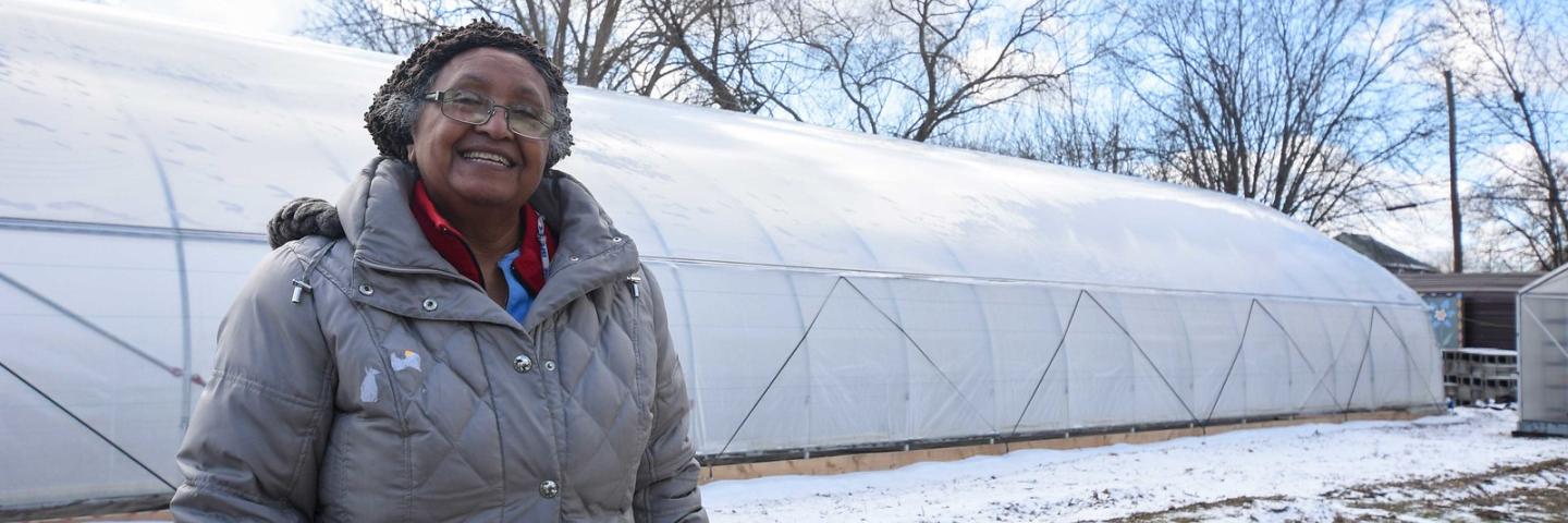 Aster Bekele, the founder of The Felege Hiywot Center in Indianapolis, Indiana, stand by the center's high tunnel that was built in November 2020 and will be planted for the first time in Spring 2021. The high tunnel was funded in part through the NRCS's Environmental Quality Incentives Program. (Indiana NRCS photo by Brandon O'Connor)