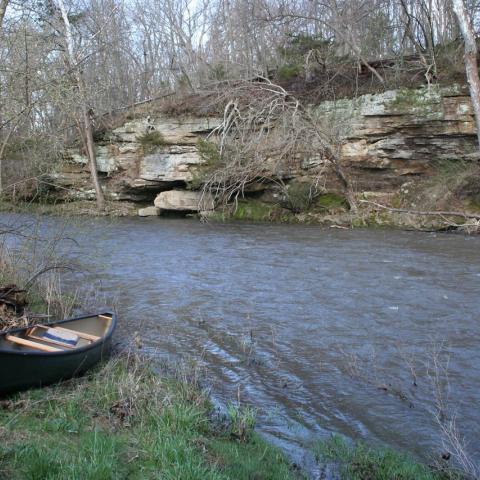 A canoe sits on the bank of Bog Pine Creek
