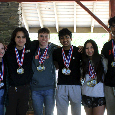 Winners of the 2023 Envirothon pose from Wheeler School with their teacher (left) and NRCS-RI State Conservationist, Pooh Vongkhamdy (right).