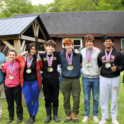 NRCS State Resources Conservationist, Cassius Spears, Jr. (left), awarded 2025 RI Envirothon Champs, Wheeler School, Team 1, which will be representing Rhode Island at the International Envirothon competition.