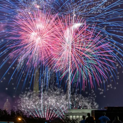 Independence Day celebration with fireworks are seen from the Iwo Jima, U.S. Marine Corps Memorial in Arlington, VA on Jul. 4, 2021. In the distance are the Lincoln Memorial, the U.S. Department of Agriculture (USDA) Yates Building (dark red brick building), the Washington Monument and the U.S. Capitol building in Washington, D.C. USDA photo by Lance Cheung.
