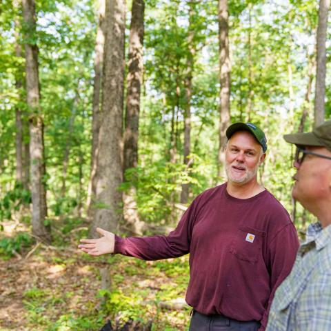 David Ray (left) and Daniel Shaver, Indiana NRCS state forester, talk about ways to improve Rayâs forestland in Jackson County, IN during a tour May 24, 2022. Ray purchased 310 acres of forestland in 1995 to use for recreational purposes including hunting, hiking and foraging. Ray enrolled his land in NRCSâ Environmental Quality Incentives Program in 2017 for forest stand improvement and brush management. After the conclusion of his EQIP contract, he enrolled the acres in NRCSâ Conservation Stewardship P