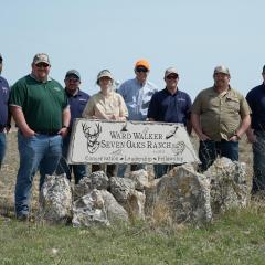 NRCS employees, landowner and Quail Forever employees standing together.