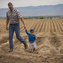 Mark Kimm and his son on the Kimm Farm near Manhattan, Mont. Gallatin County, Montana