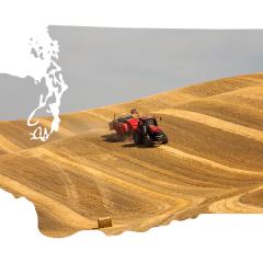 Harvesting on the Palouse framed by Washington state outline